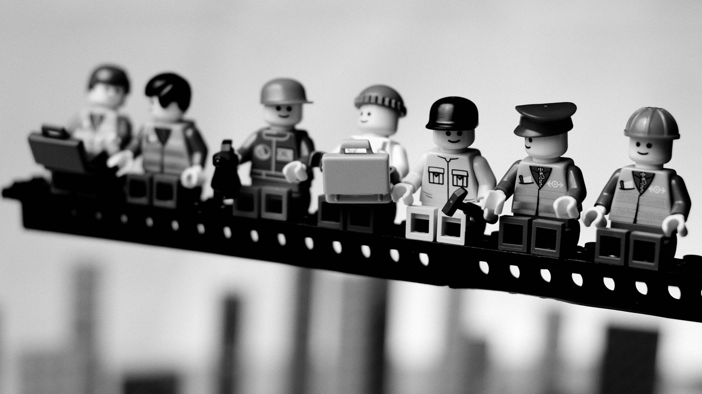Lego figures on a beam