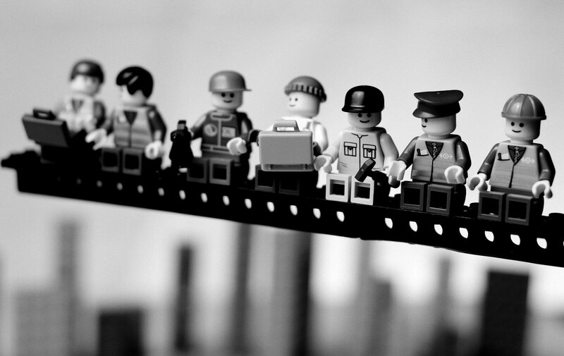 Lego figures on a beam