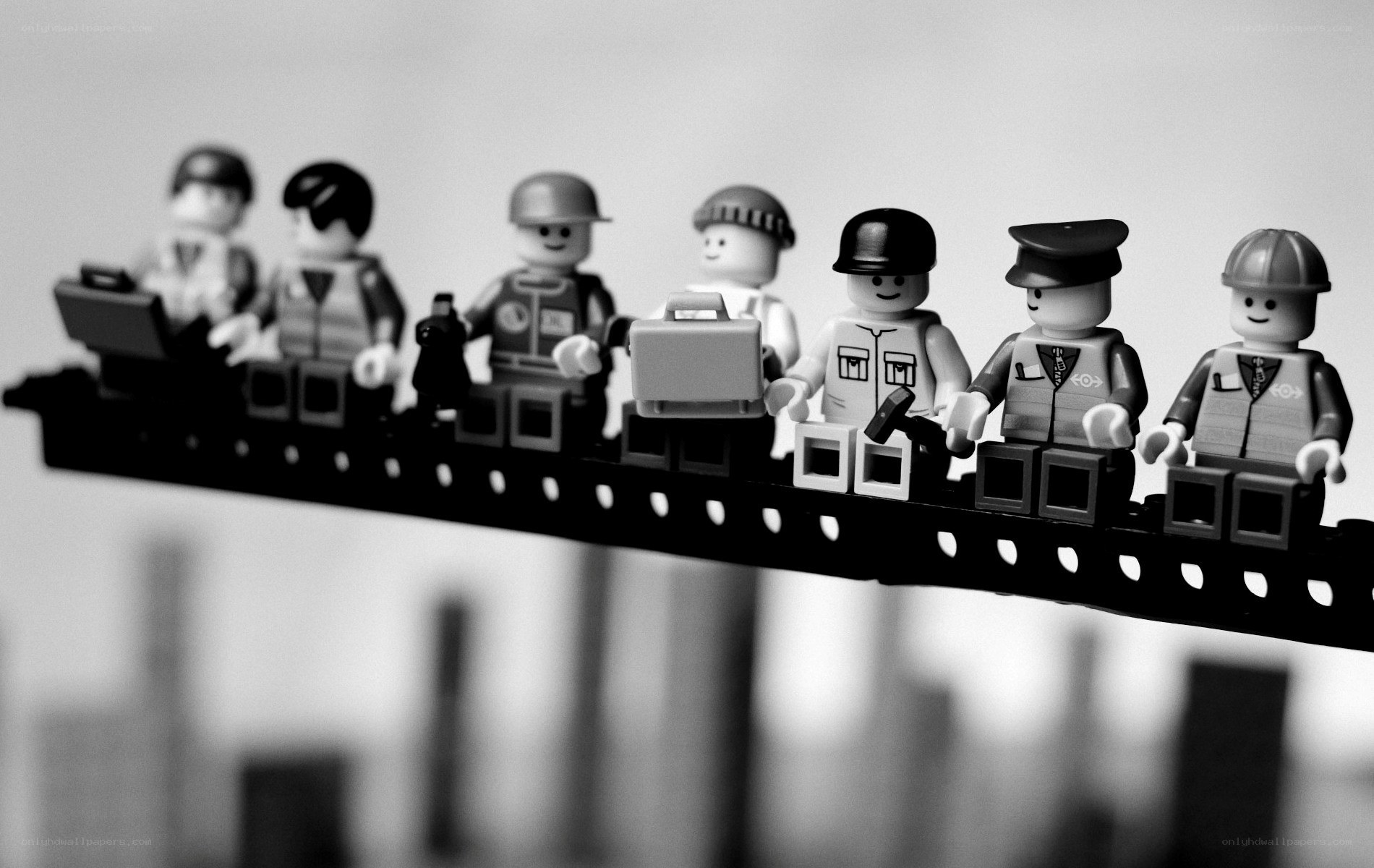 Lego figures on a beam