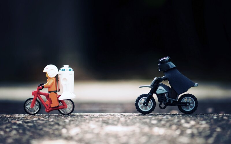 Lego Figures on Bikes — Black, Dramatic