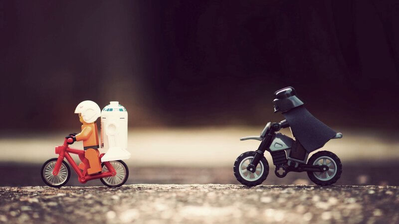 Lego Figures on Bikes — Red, Dramatic, Photograph