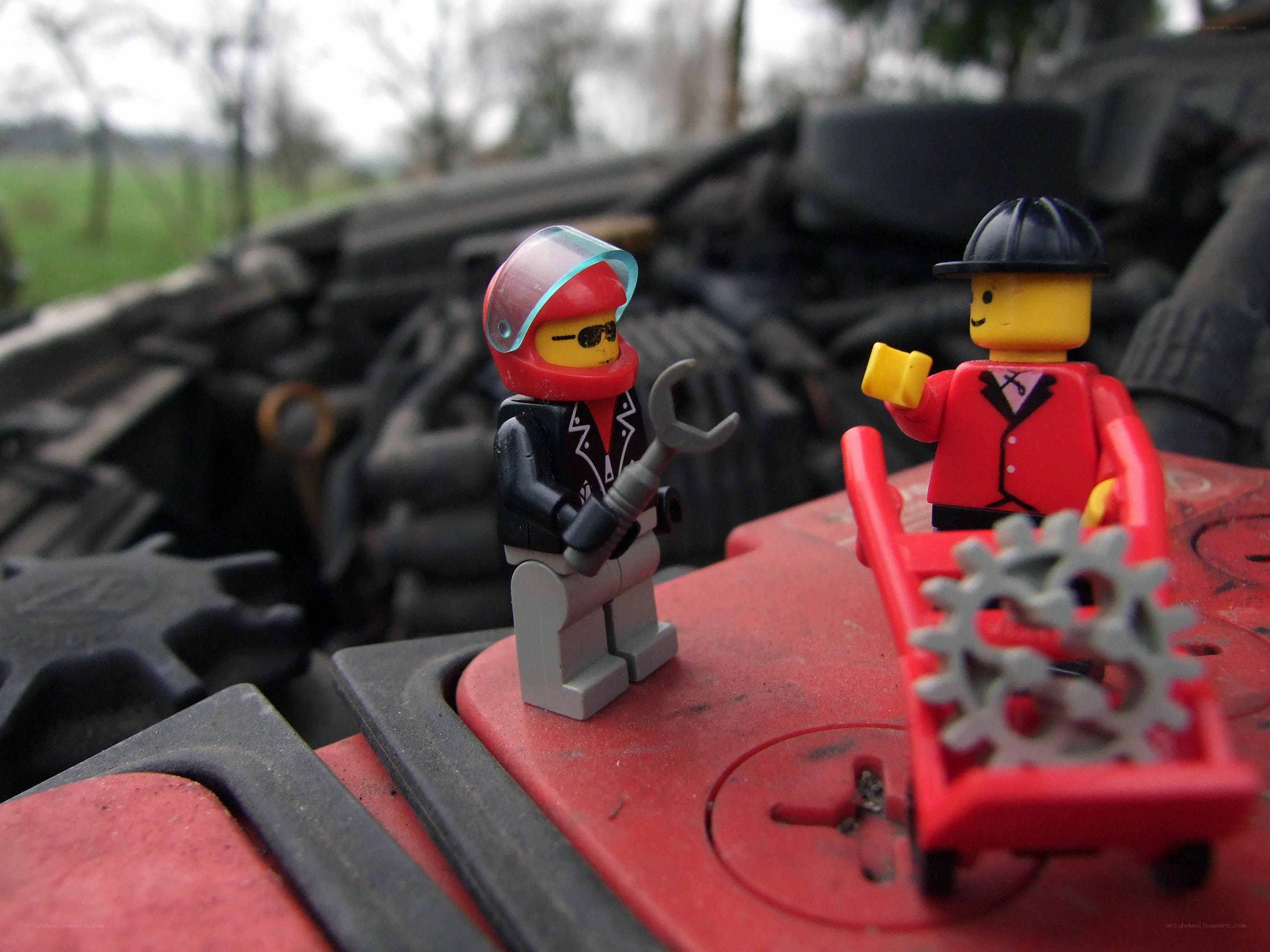Lego figures on car battery