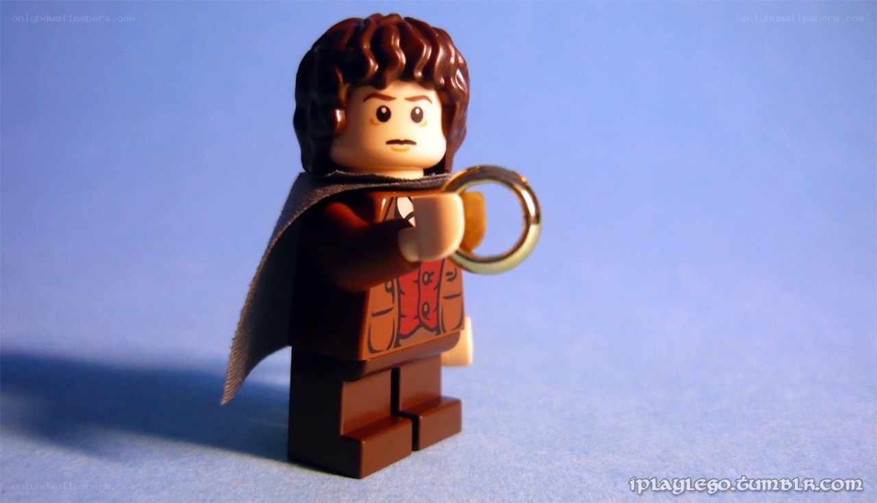 Lego Frodo holding the One Ring