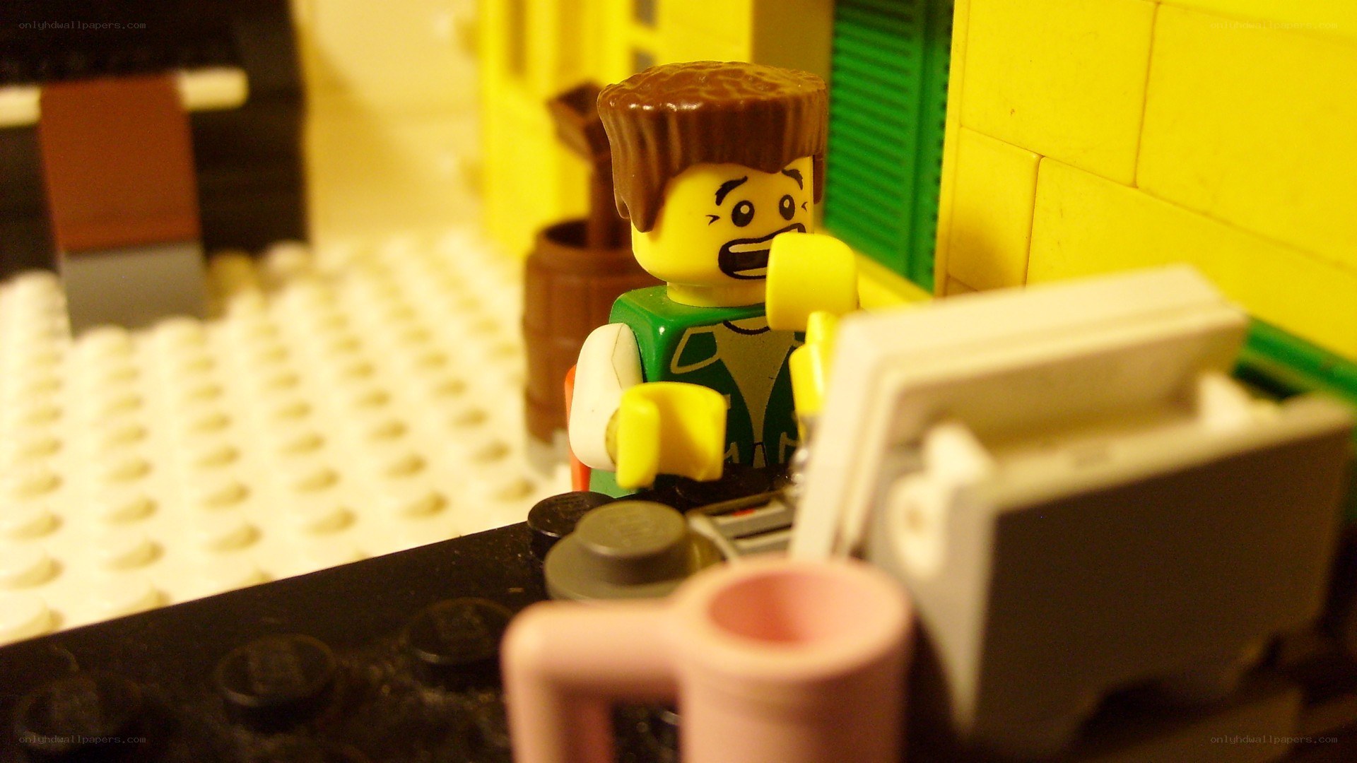 Lego minifigure at a desk