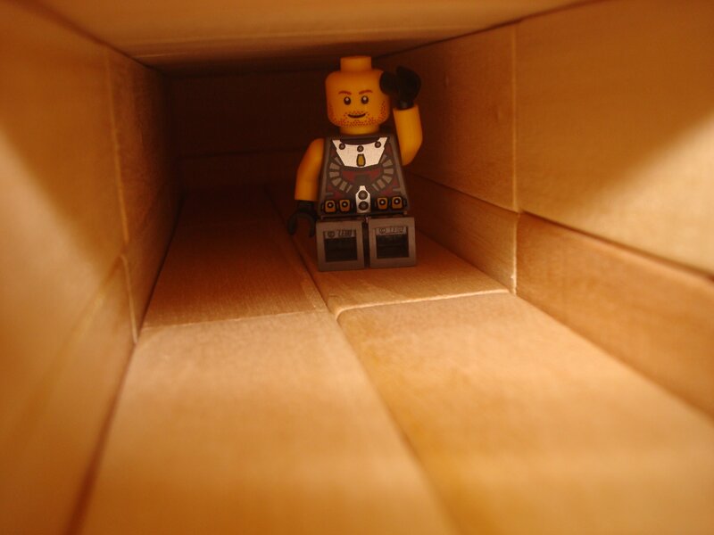 Lego minifigure in cardboard box