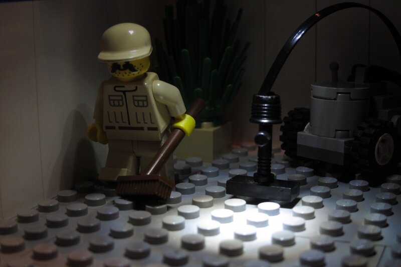 Lego minifigure with broom