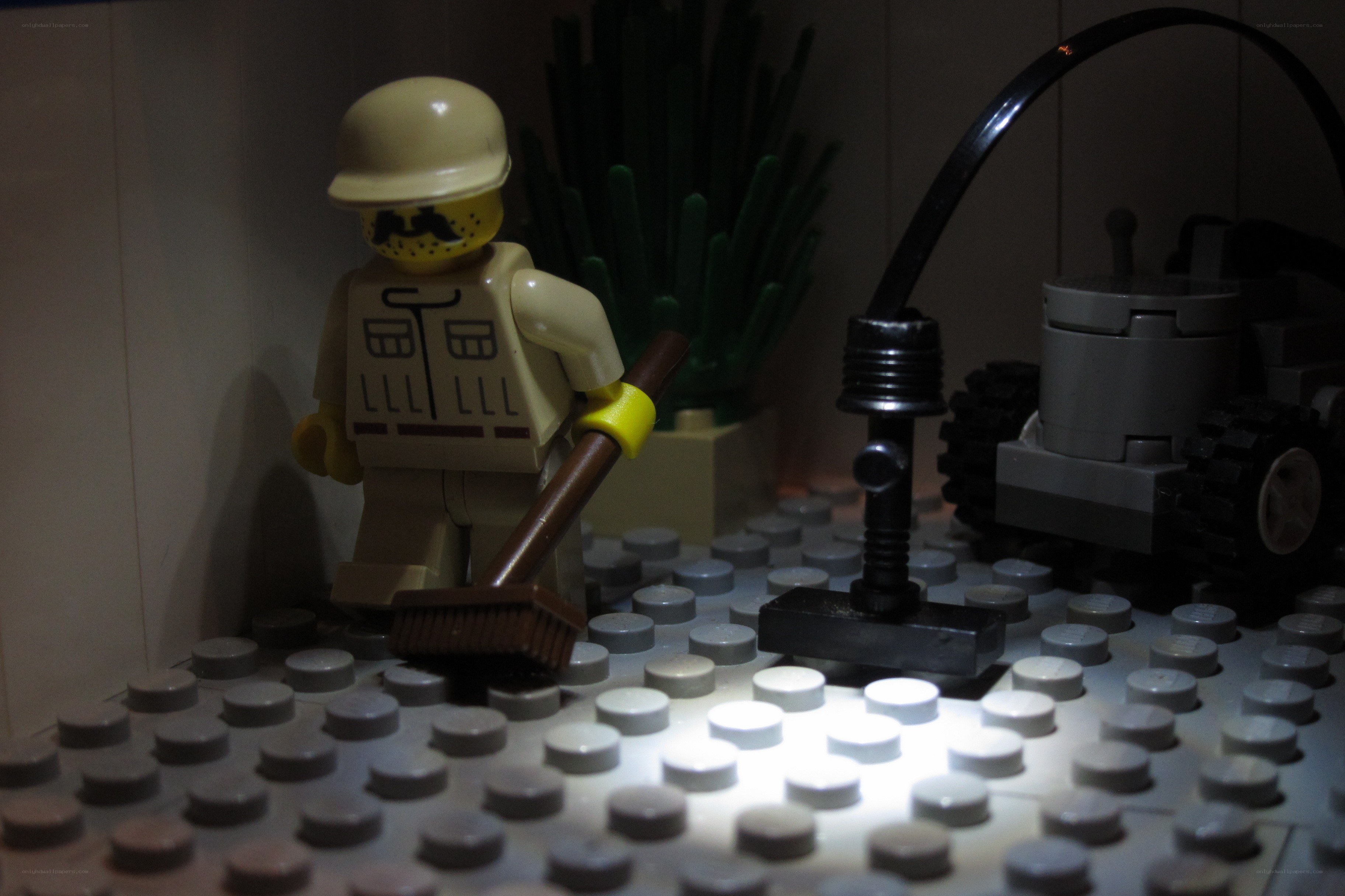 Lego minifigure with broom