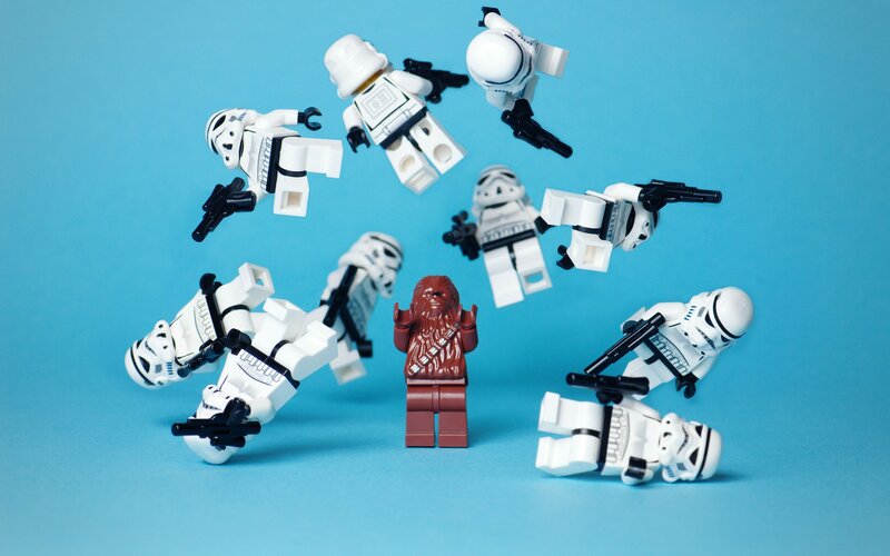 Lego stormtroopers surround Chewbacca