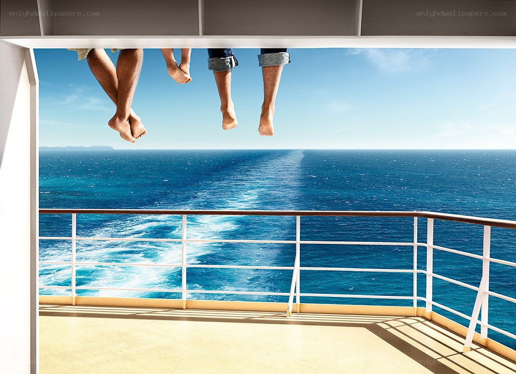 Legs dangling on cruise ship deck