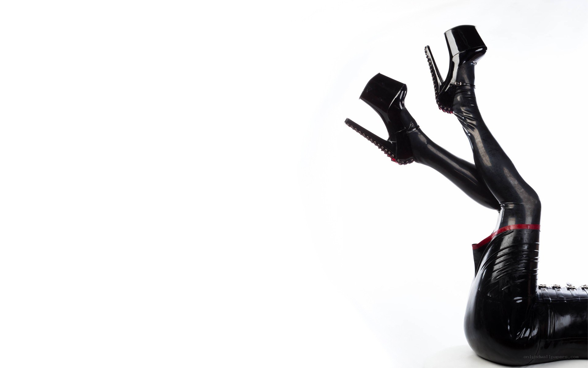legs in black latex boots