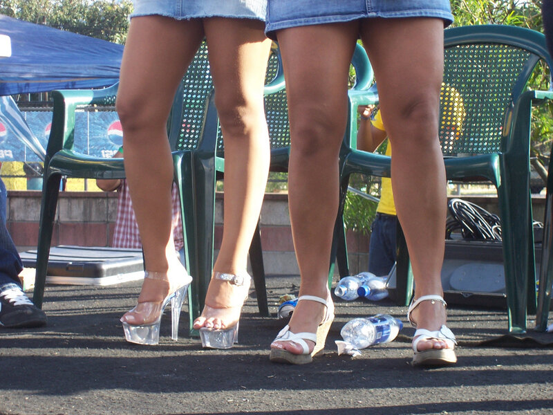 Legs in high heels at outdoor event