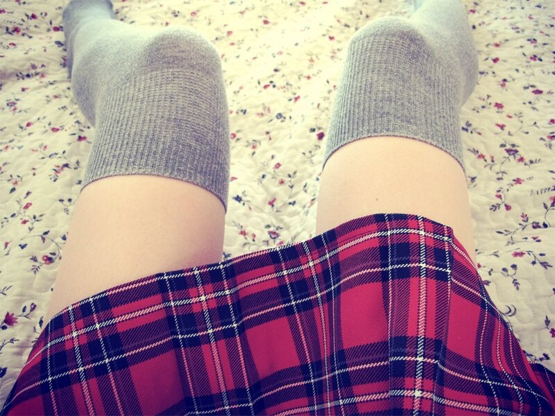 legs in plaid skirt and socks