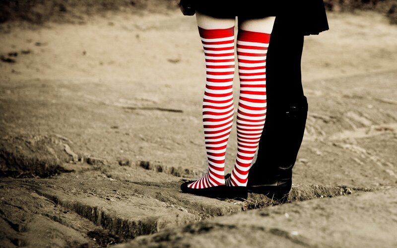 Legs in red and white striped socks