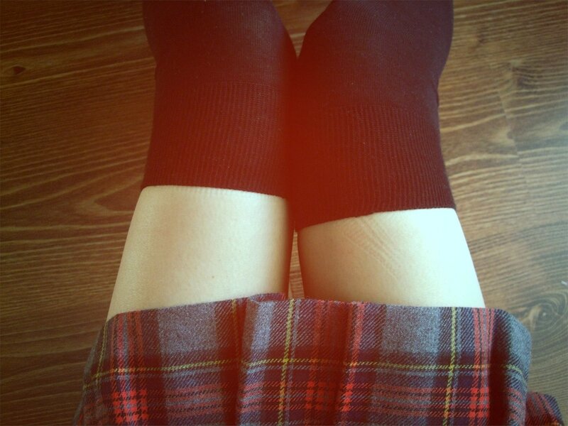 legs in socks and plaid skirt