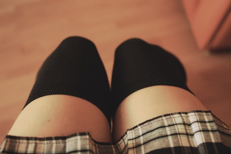legs in socks and plaid skirt