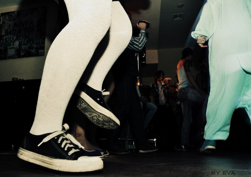 Legs in white tights at a party