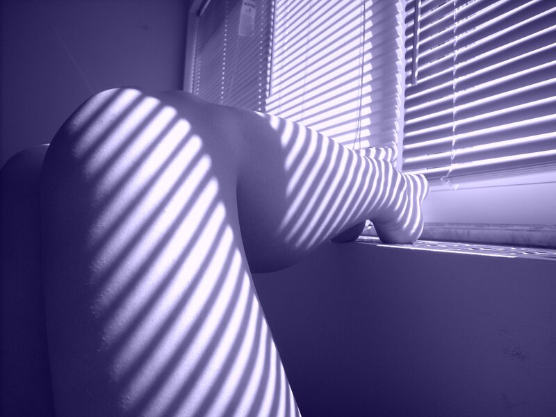 Legs in window light
