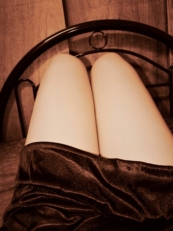 legs on a bed with velvet fabric