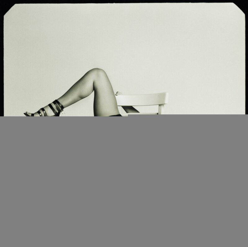 Legs on a chair in black and white