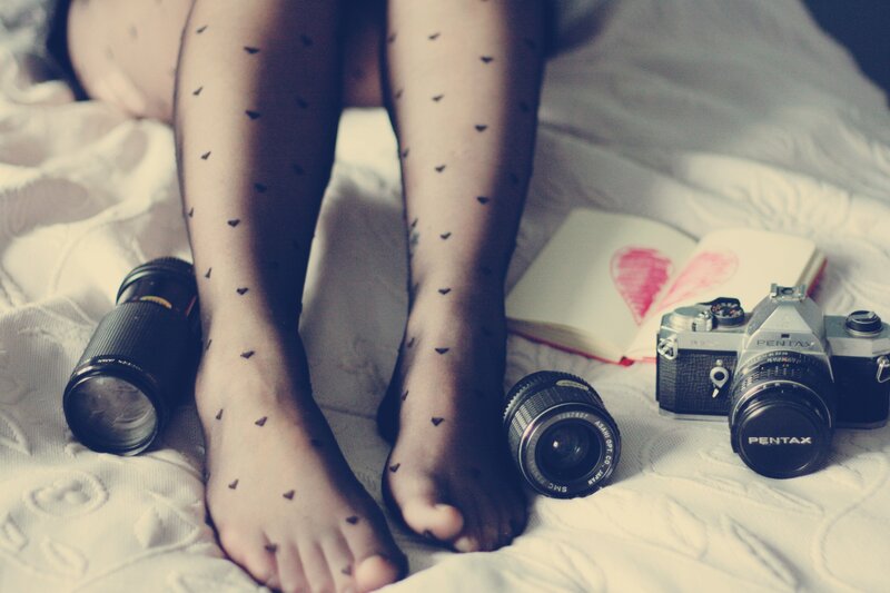 Legs with heart tights and camera