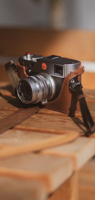 Leica Camera on Wooden Surface