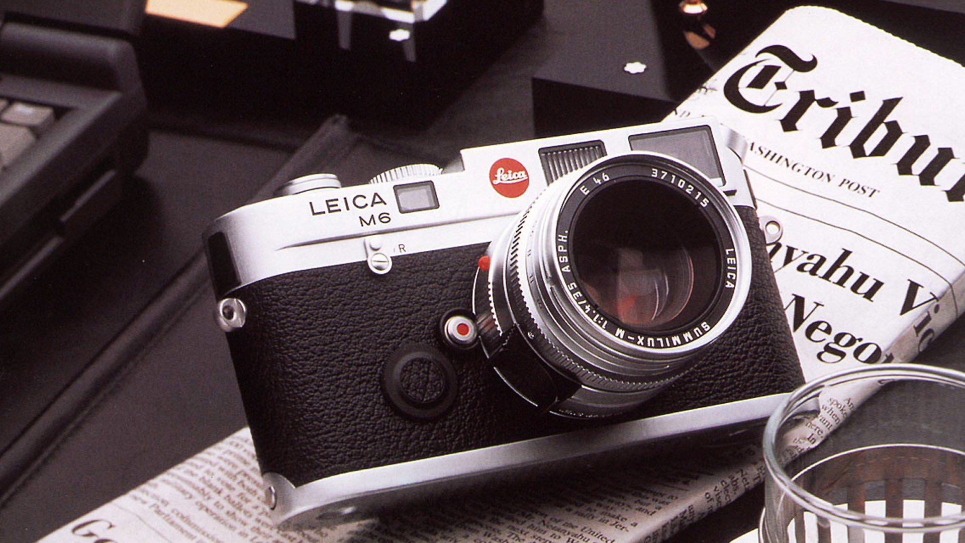 Leica M6 camera on newspaper
