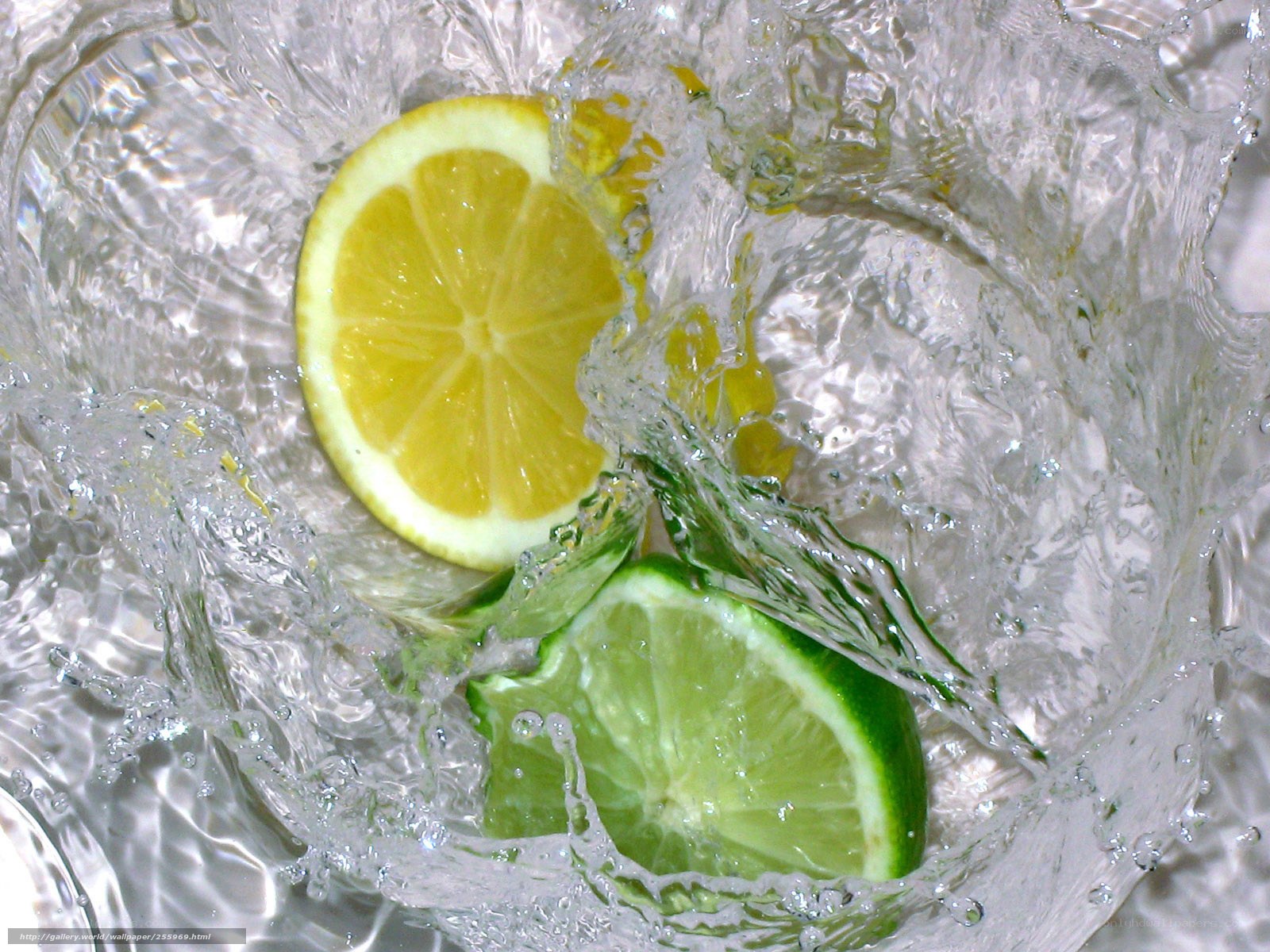 lemon and lime in splashing water