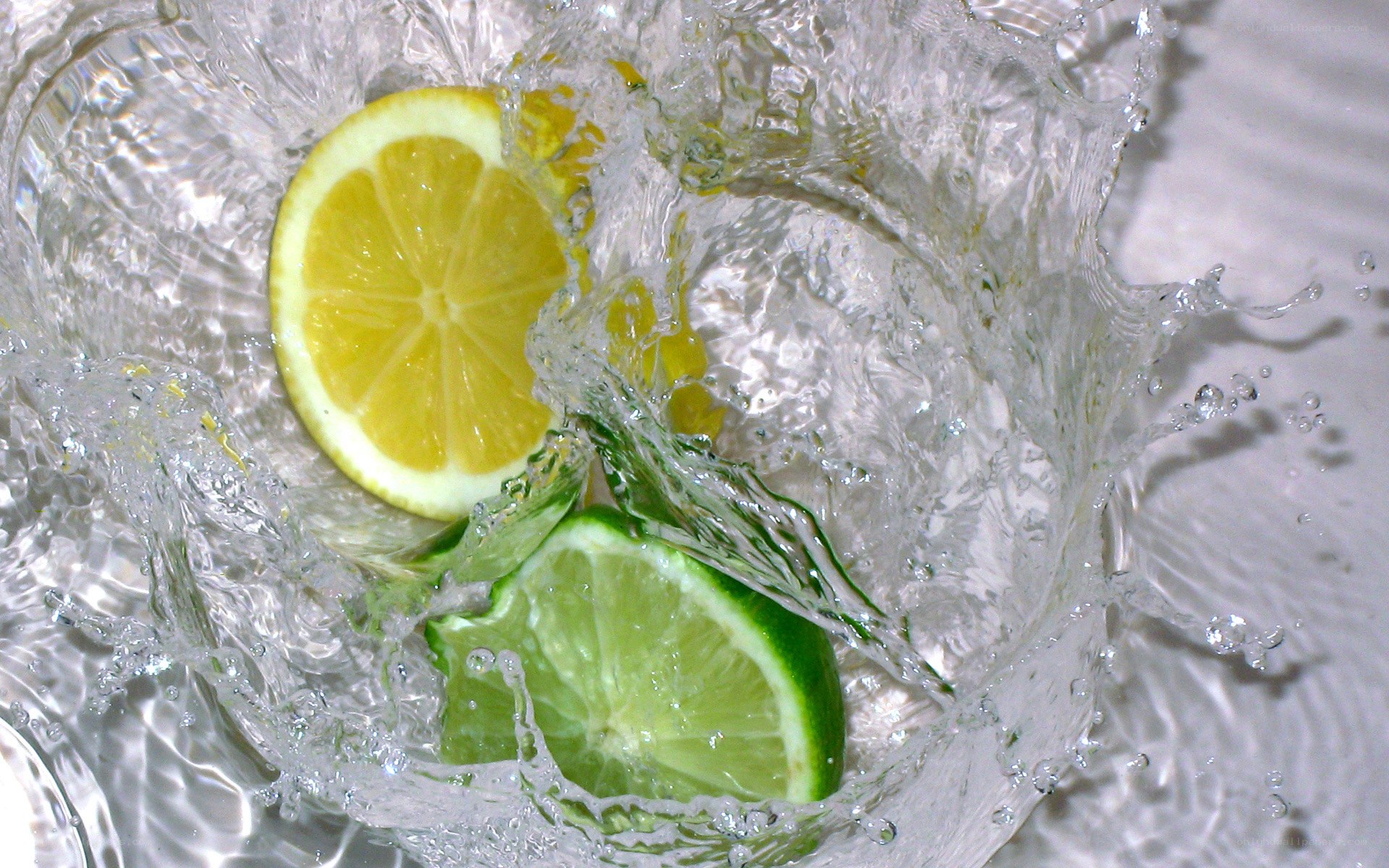 lemon and lime in water splash