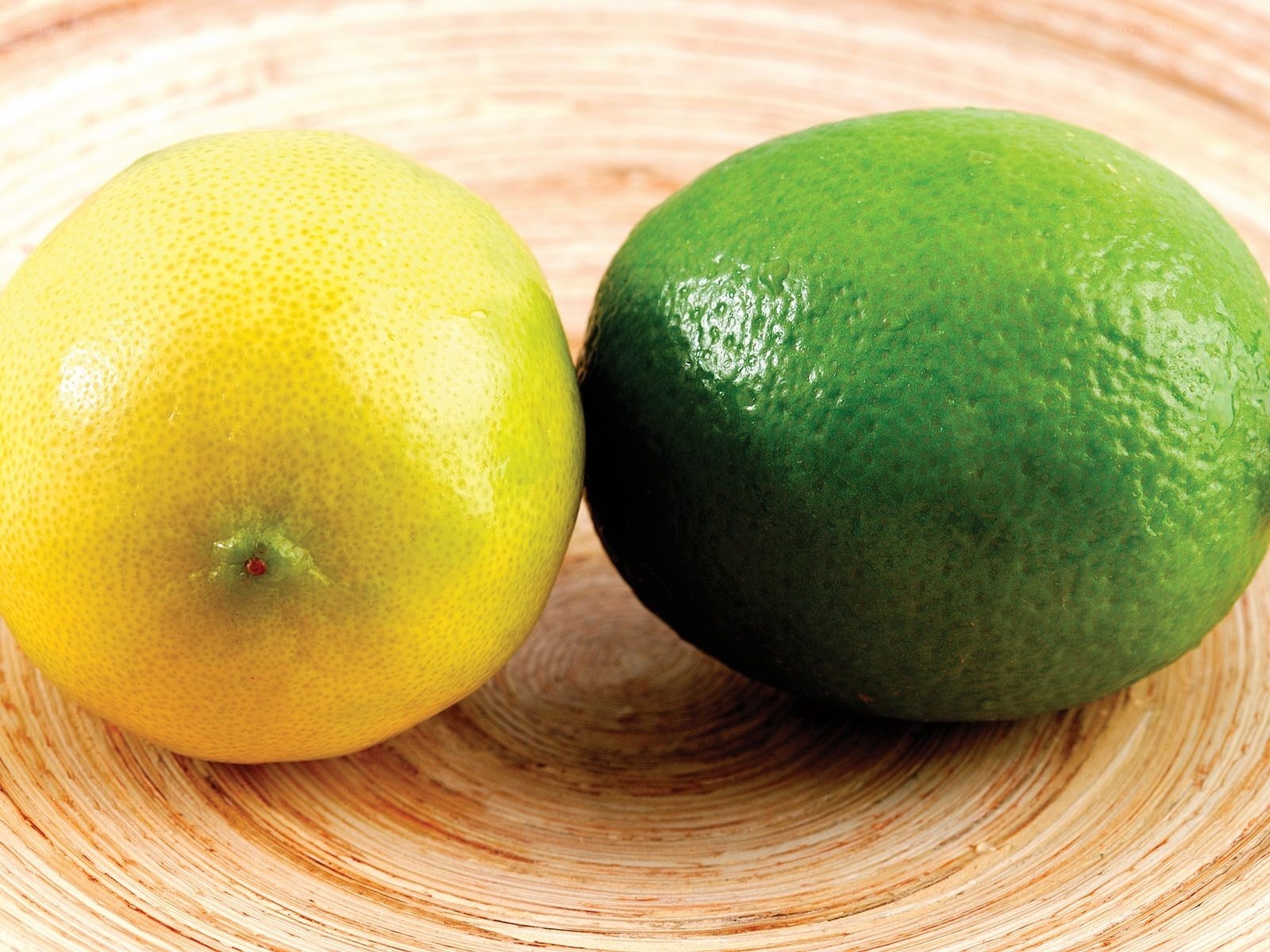 lemon and lime on wood