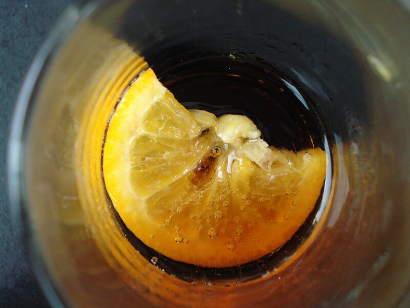 lemon slice in dark drink