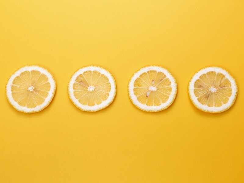 lemon slices on yellow background
