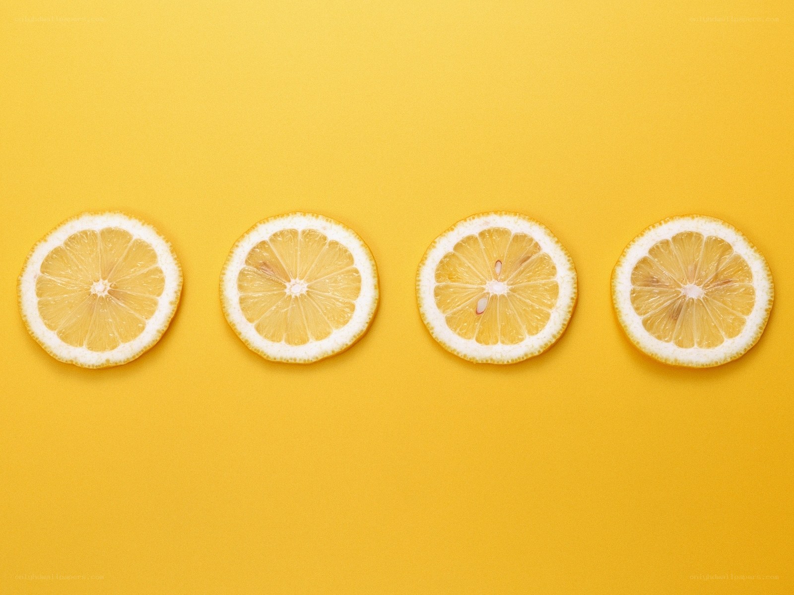 lemon slices on yellow background