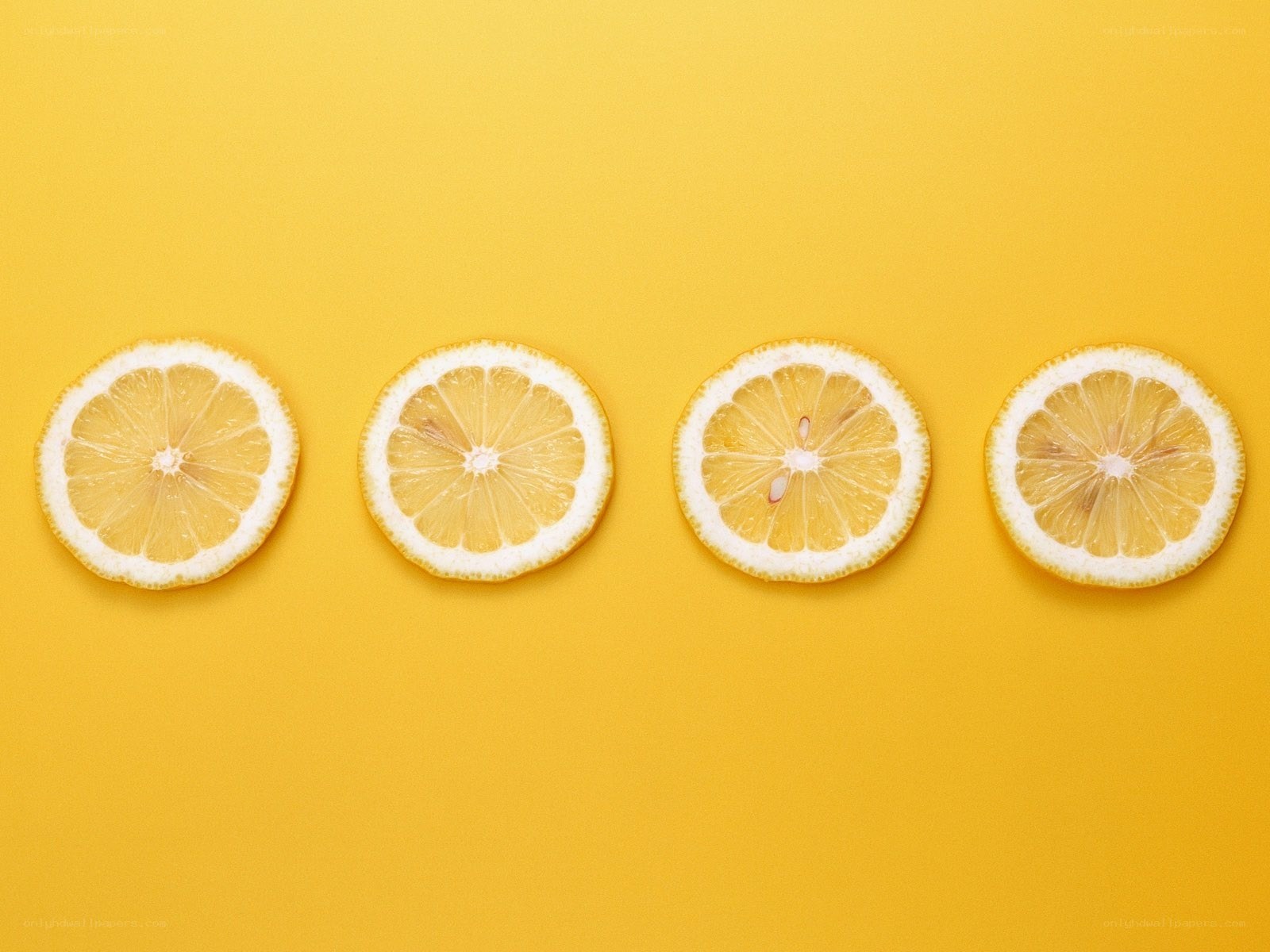 lemon slices on yellow