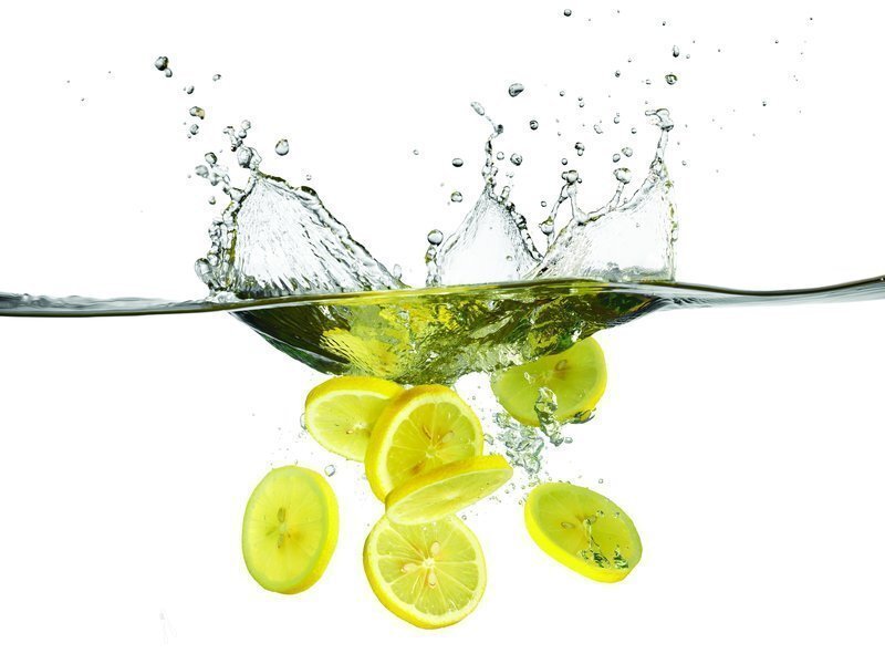 lemon slices splashing in water