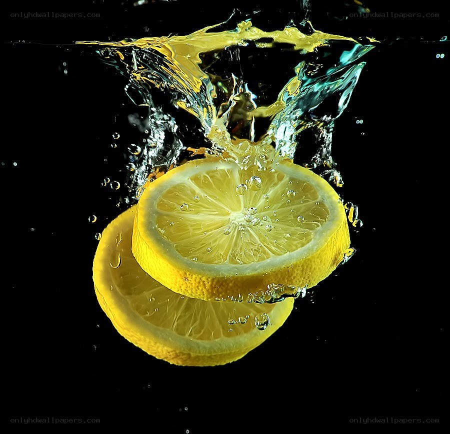 lemon slices splashing in water