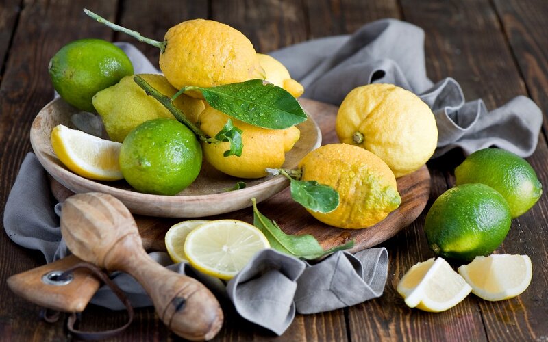 Lemons and Limes on Wood