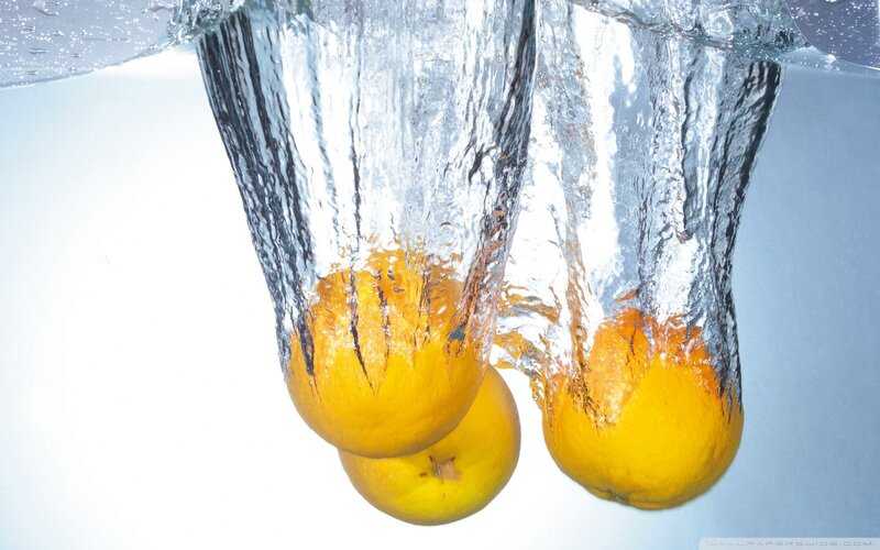 lemons falling into water