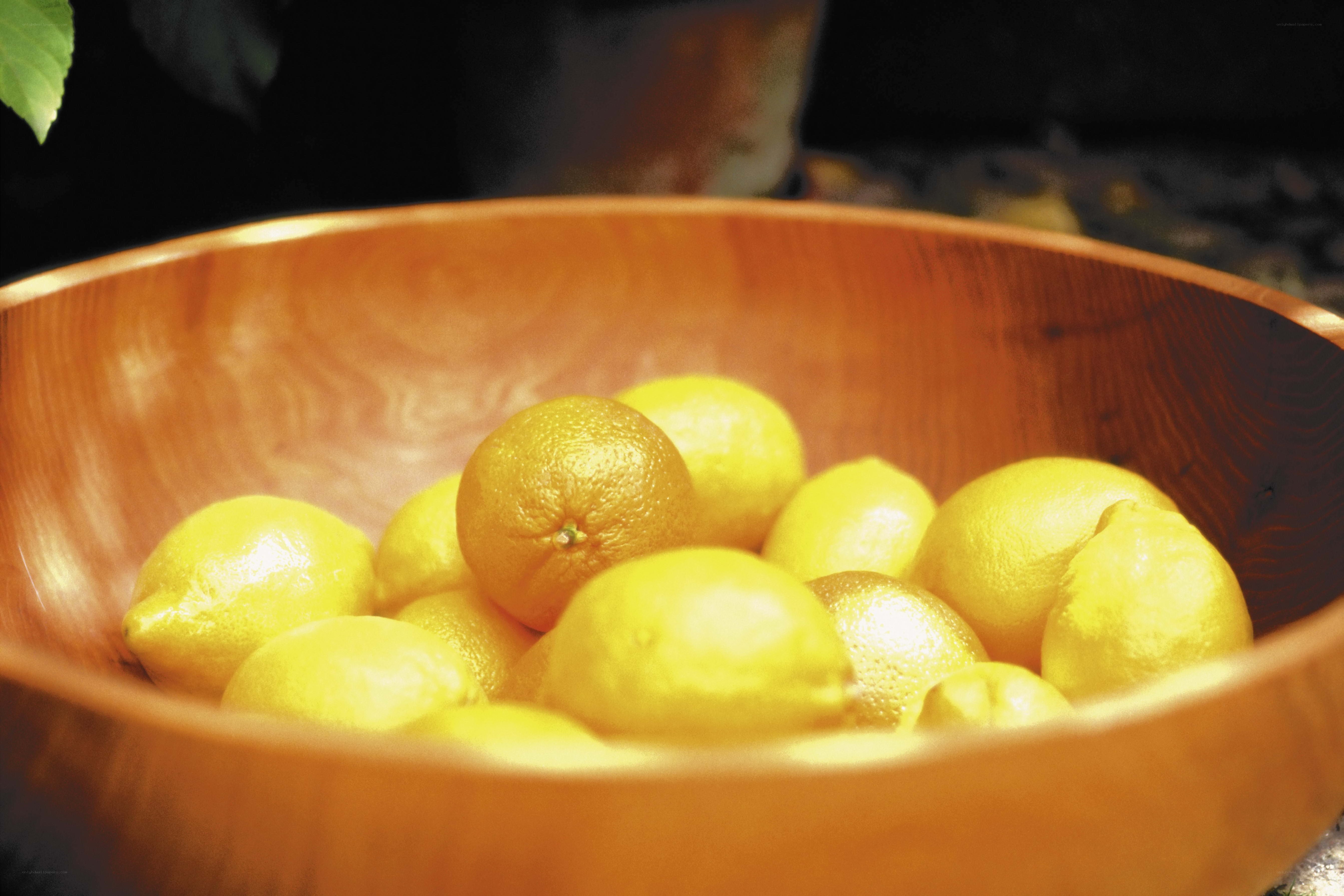 lemons in a wooden bowl