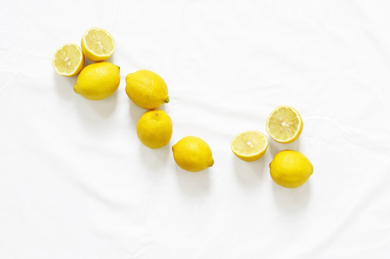 lemons on white surface