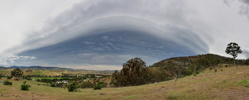 Lenticular cloud over rural landscape