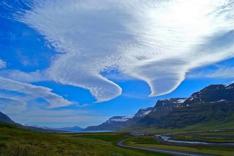 Lenticular clouds over a valley