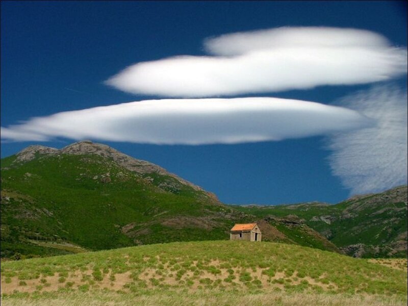 Lenticular clouds over mountain hut