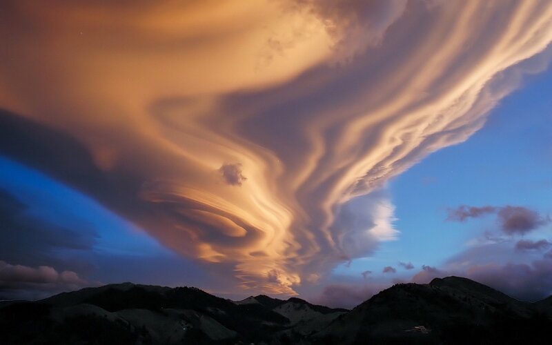 Lenticular Clouds over Mountains — Orange, Dramatic