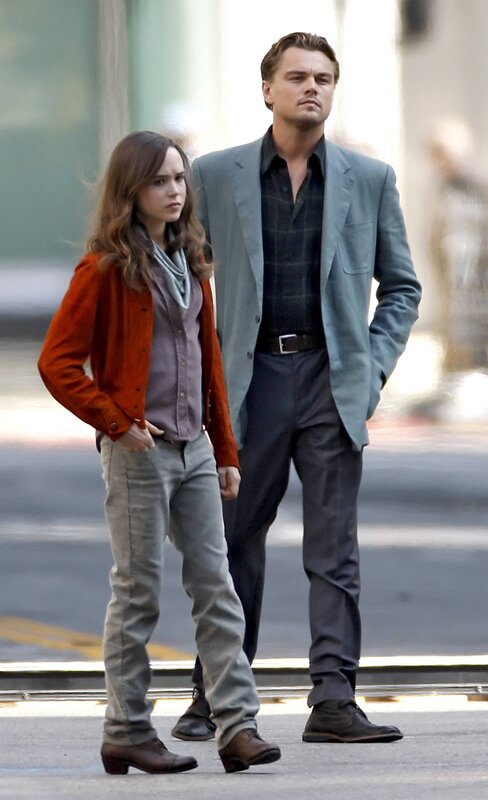 Leonardo DiCaprio and a woman walking