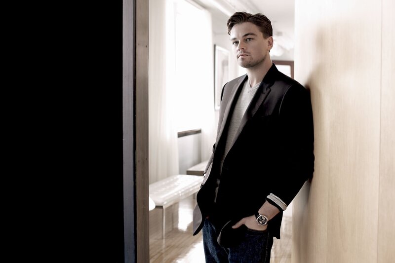 Leonardo DiCaprio leaning against wall