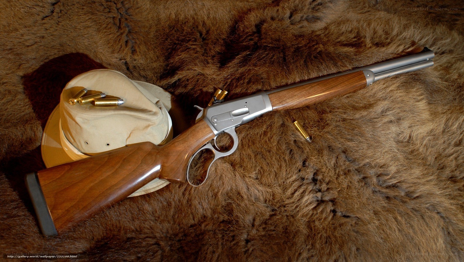 lever-action rifle on fur
