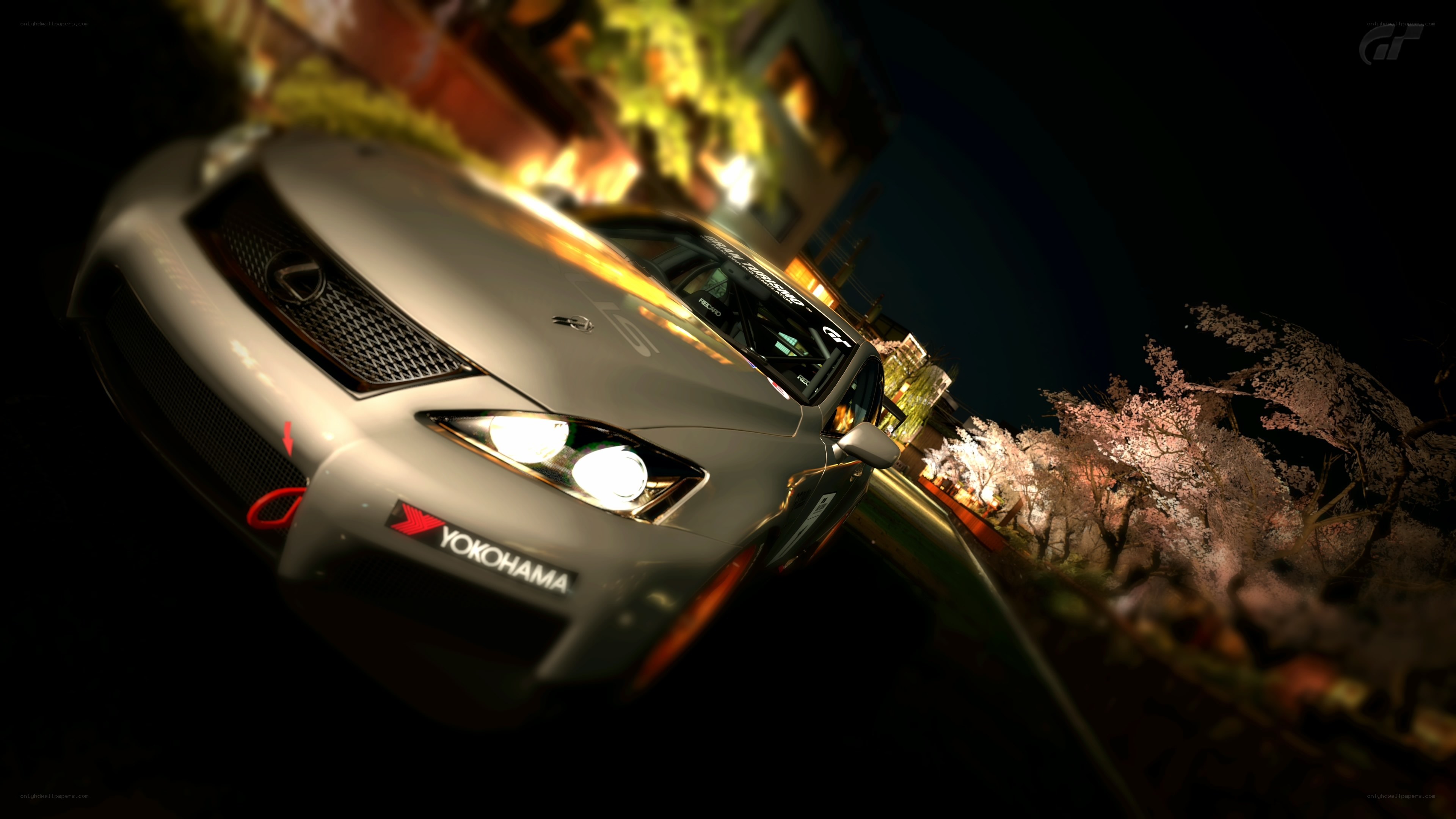Lexus IS at night with cherry blossoms