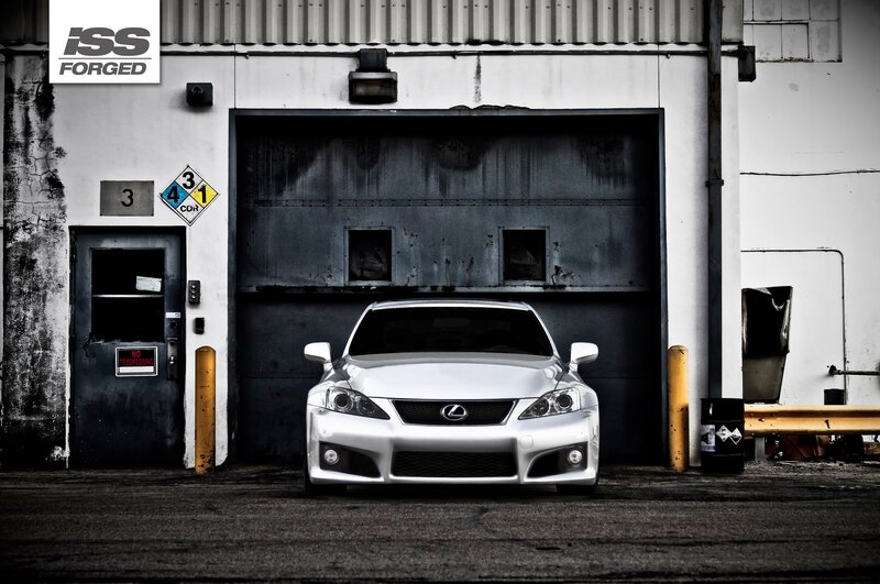 Lexus IS in front of garage