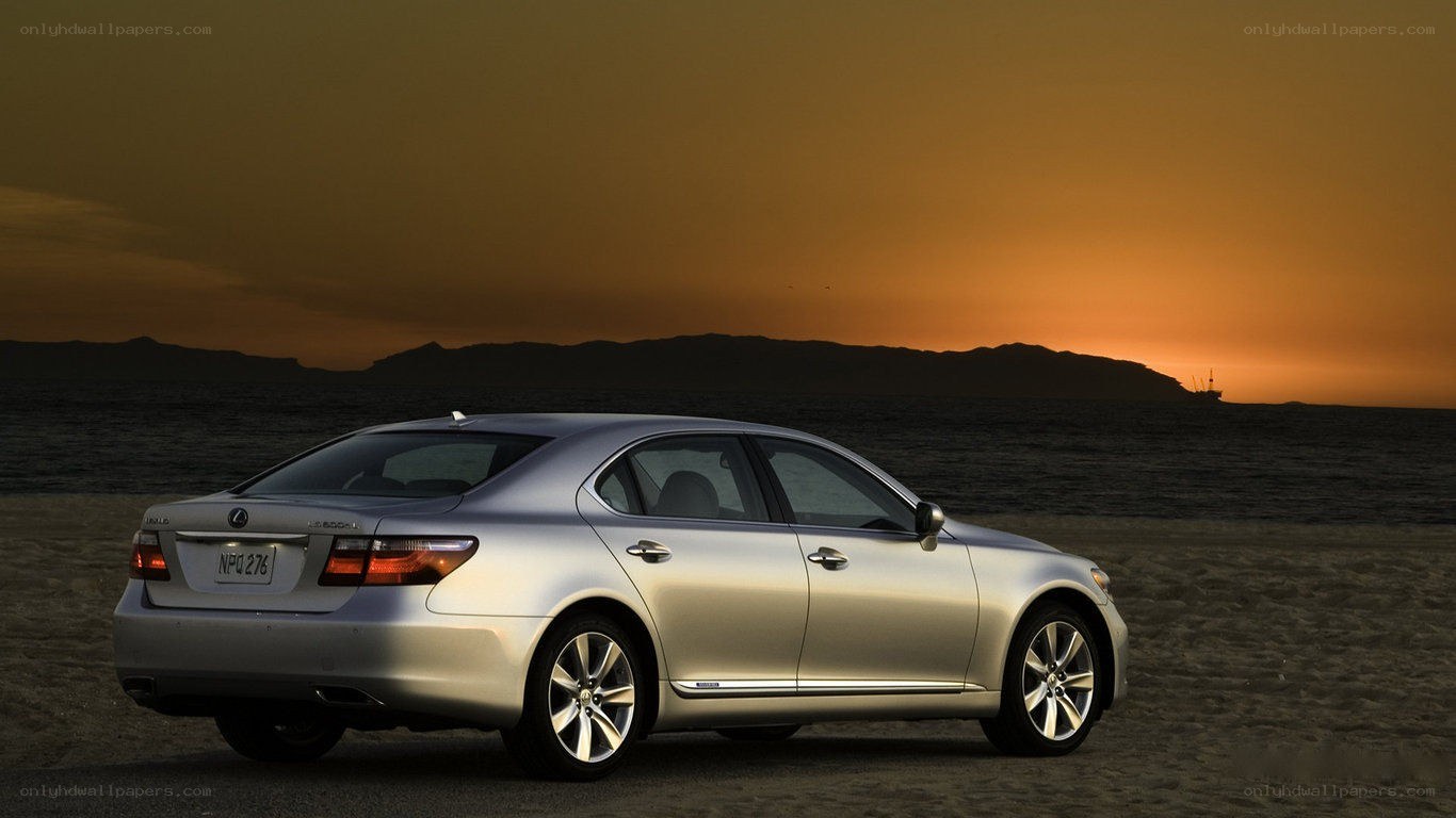 Lexus LS on beach at sunset