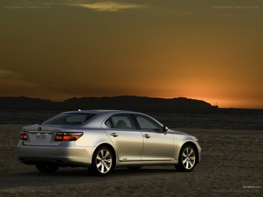 Lexus LS on beach at sunset